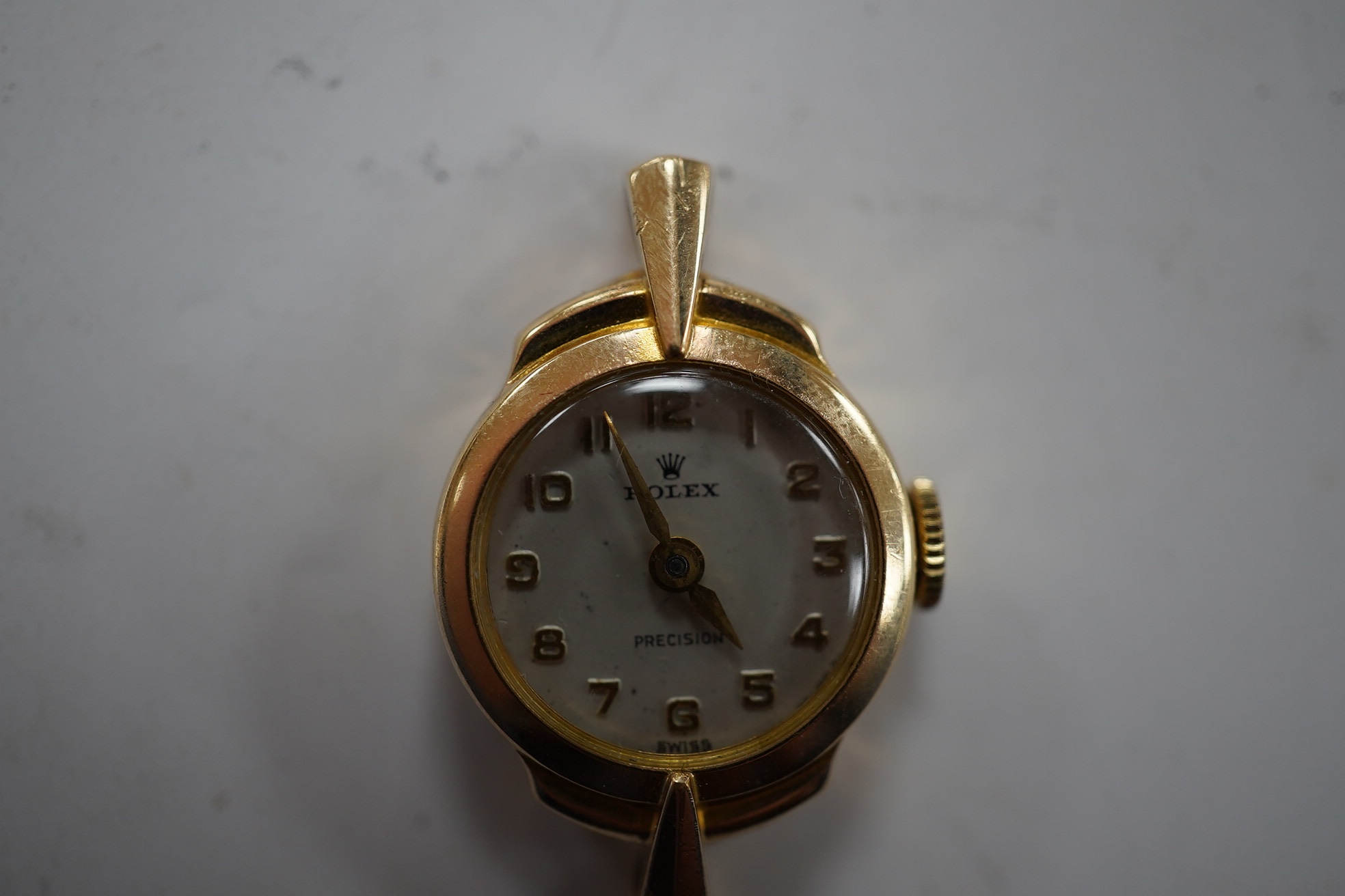 A lady's 9ct gold Rolex Precision manual wind wrist watch, with Arabic dial and case back inscription, no strap, gross weight 7.3 grams, Condition - fair